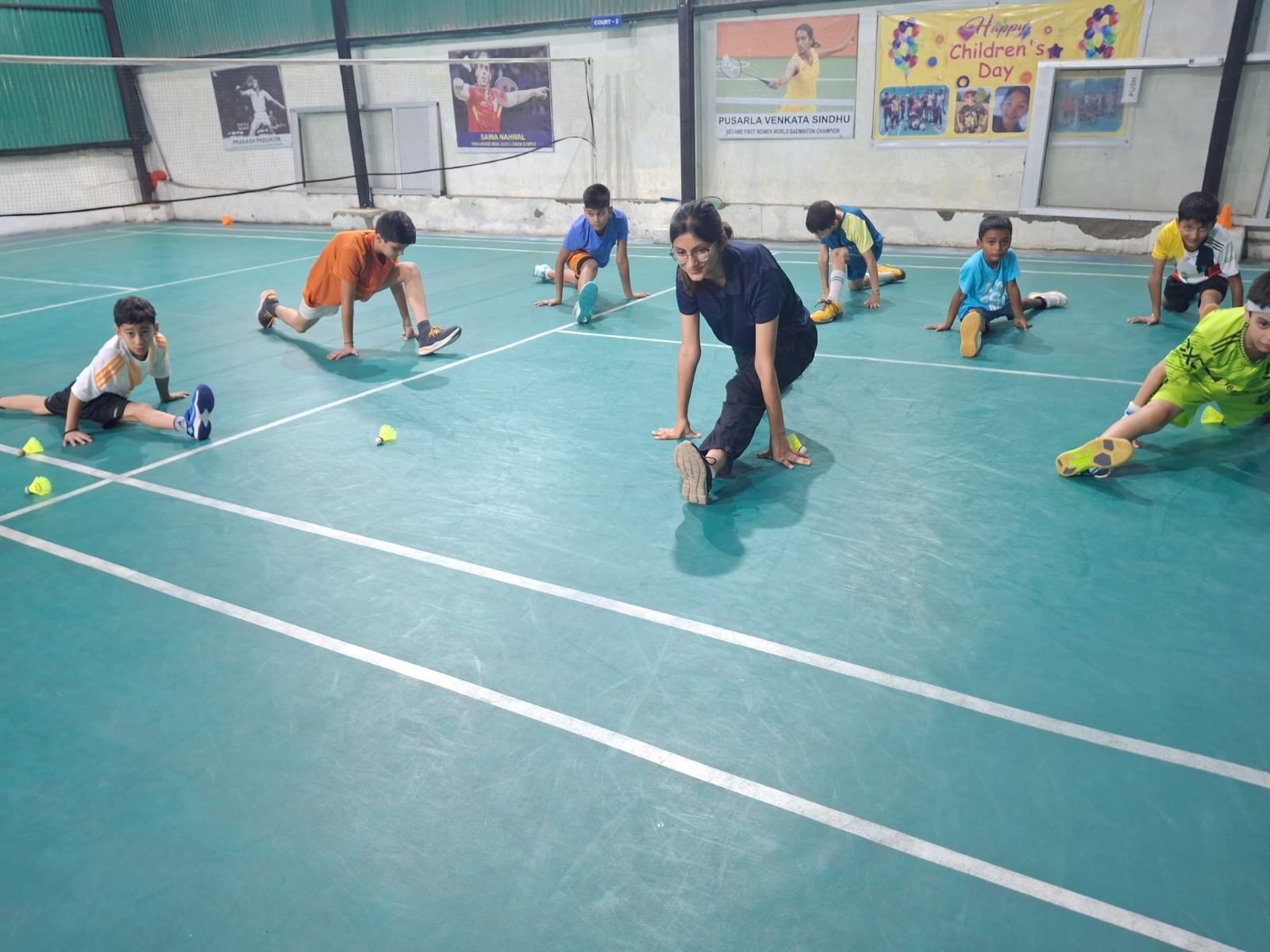 Juniors stretching before drills